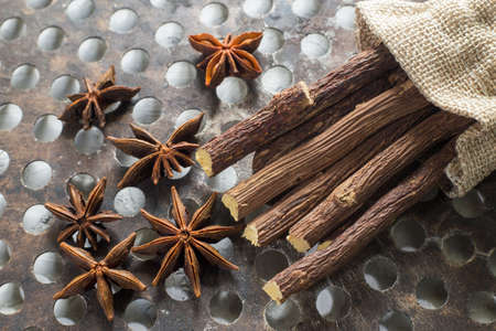 licorice root and anise on the table - Glycyrrhiza glabra.の写真素材