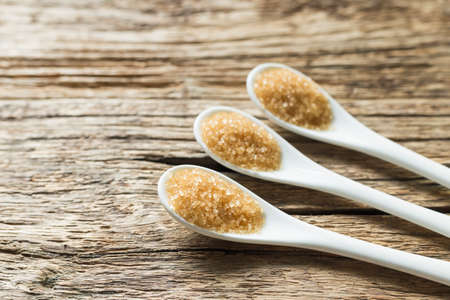 brown sugar in spoon on the table.の写真素材