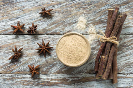 licorice root and flour and anise on the table.の写真素材