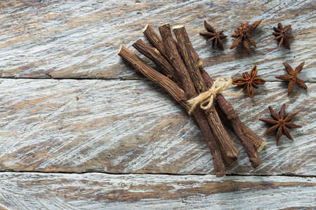 licorice root and anise on the table - Glycyrrhiza glabra.の写真素材