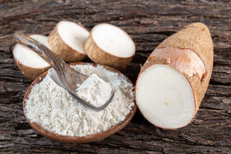 Raw yucca starch on the wooden table - Manihot esculenta..の写真素材