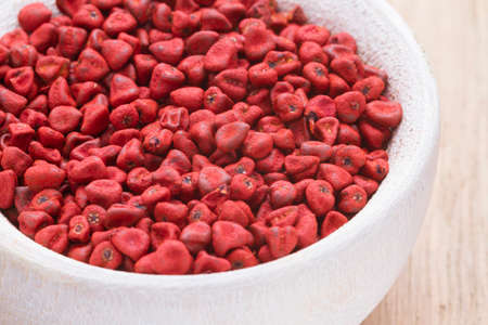 annatto beans in bowl on the table seen from up close.の写真素材