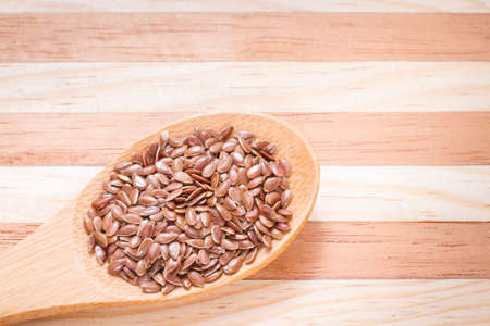flax seed grains on the table, Linum usitatissimumの写真素材