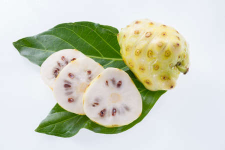 Noni fruits isolated on white background, Morinda citrifolia.の写真素材