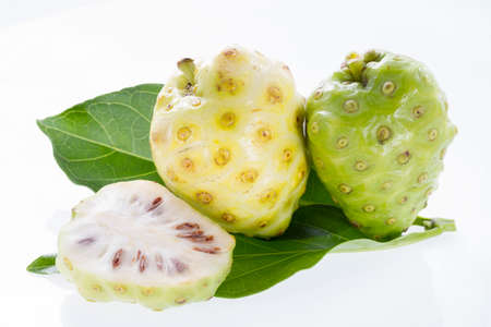 Noni fruits isolated on white background, Morinda citrifolia.の写真素材