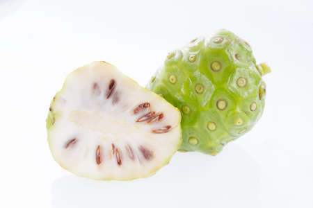 Noni fruits isolated on white background, Morinda citrifolia.の写真素材