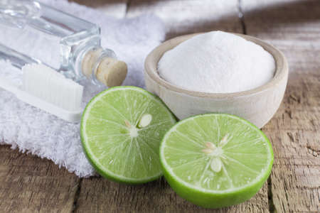 baking soda and lemon on wooden tableの写真素材
