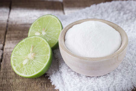 baking soda and lemon on wooden tableの写真素材