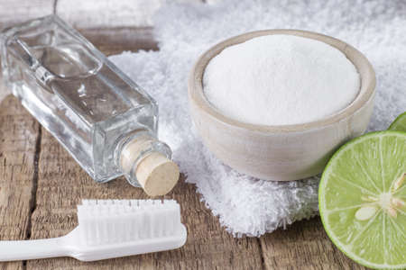 baking soda and lemon on wooden tableの写真素材