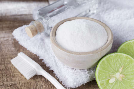 baking soda and lemon on wooden tableの写真素材