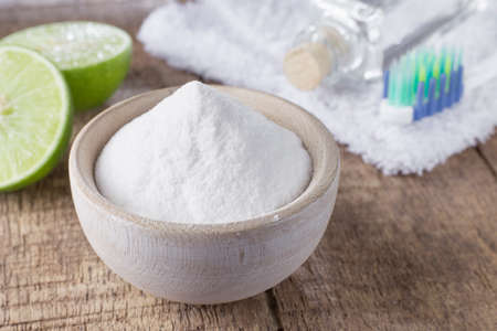 baking soda and lemon on wooden tableの写真素材
