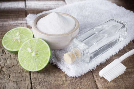 baking soda and lemon on wooden tableの写真素材