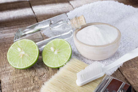 baking soda and lemon on wooden tableの写真素材