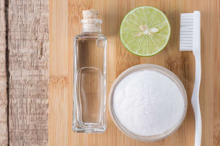 baking soda and lemon on wooden tableの写真素材