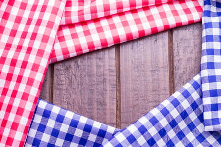blue and red kitchen cloths on woodの写真素材