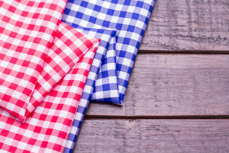blue and red kitchen cloths on woodの写真素材