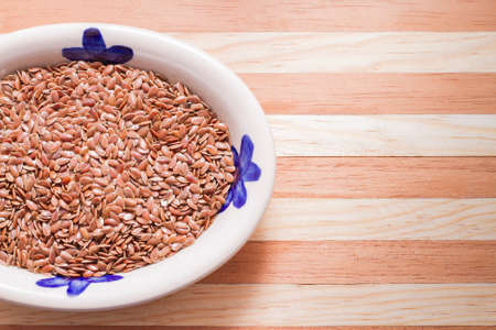 flax seed grains on the table, Linum usitatissimumの写真素材
