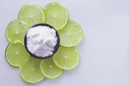 baking soda and slices of lemon on white background.の写真素材