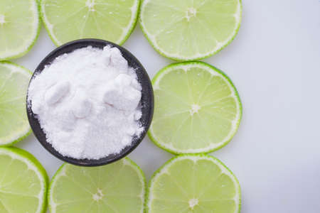 baking soda and slices of lemon on white background.の写真素材