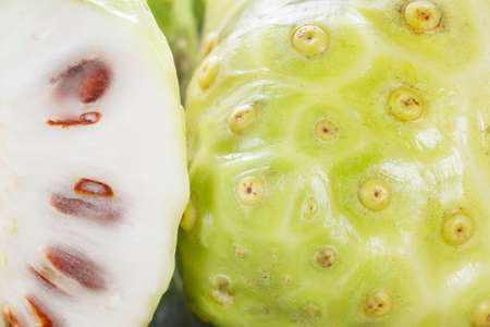 Noni fruits on the table, Morinda citrifolia.の写真素材