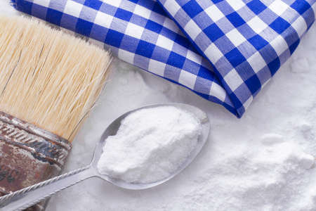 baking soda and brush are the wooden table.の写真素材