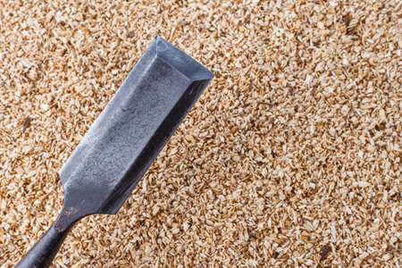 chisel carpenter, on wooden backgroundの写真素材