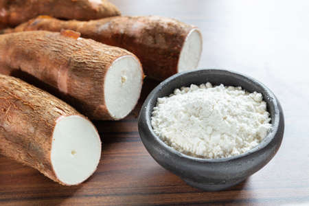 Raw yucca starch on the wooden table - Manihot esculenta..の写真素材