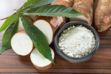 Raw yucca starch on the wooden table - Manihot esculenta..の写真素材