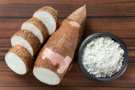 Raw yucca starch on the wooden table - Manihot esculenta..の写真素材