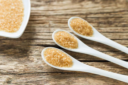 brown sugar in spoon on the table.の写真素材