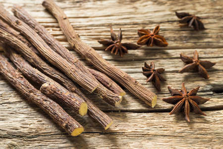 licorice root and anise on the table - Glycyrrhiza glabra.の写真素材
