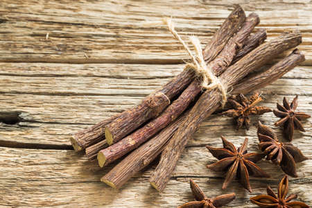 licorice root and anise on the table - Glycyrrhiza glabra.の写真素材