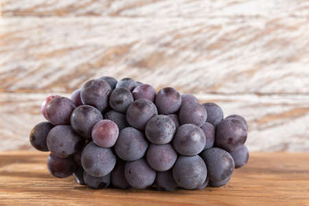 bunch of grapes for red wine on the table.の写真素材