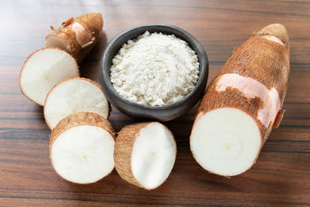 Raw yucca starch on the wooden table - Manihot esculenta..の写真素材
