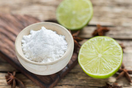 Baking soda and lemon on the table.の写真素材