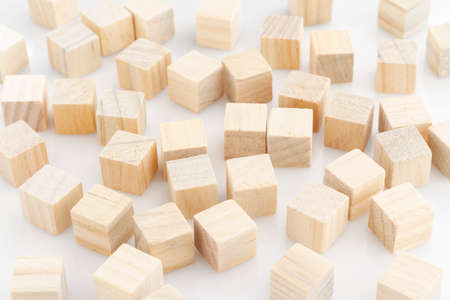 wooden blocks arranged randomly on white background.の写真素材