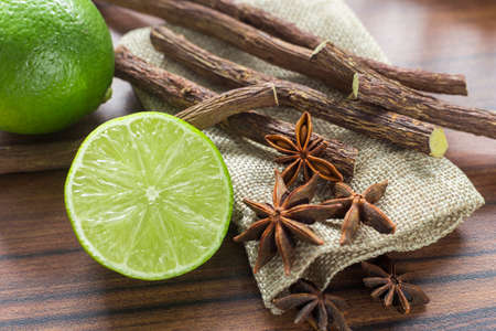 licorice root, lemon and anise on the table.の写真素材