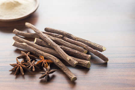 licorice root and anise on the table - Glycyrrhiza glabra.の写真素材
