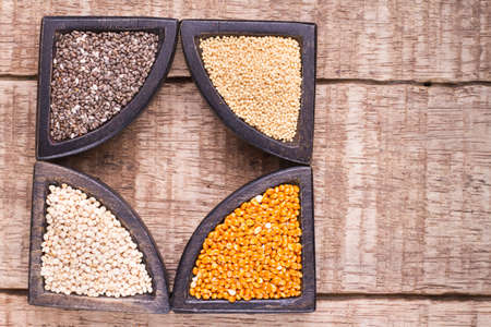 grains of super gluten-free foods: amaranth, chia, quinoa, millet in containers