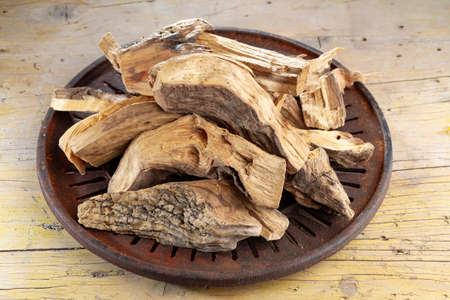 Sacred wood "palo santo" - Bursera graveolens,on rustic wood backgroundの写真素材
