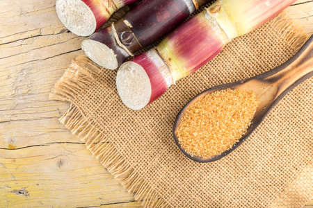 Brown sugar and cane on the table top view, imageの写真素材