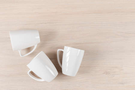 White ceramic cups on wooden background, imageの写真素材