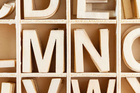 Alphabet letters in wooden box, top viewの写真素材
