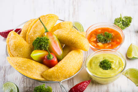 Empanadas with hot sauce, traditional Colombian foodの写真素材