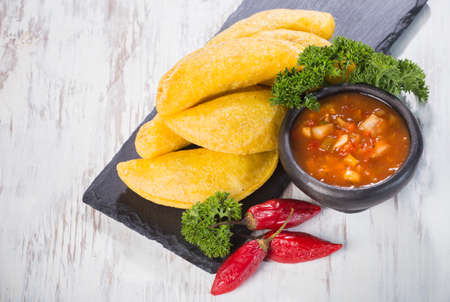 Empanadas with hot sauce, traditional Colombian foodの写真素材
