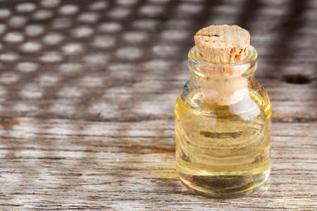Jar with cooking oil on the table, space for textの写真素材