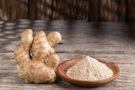 Powder and ginger root on the table, close-upの写真素材