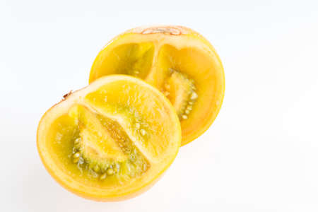 Lulo or naranjilla fruit on white, subtropical perennial plant of northwestern South America, close-up image, Solanum quitoenseの写真素材