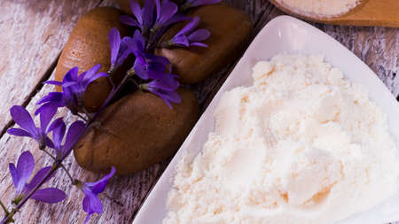 Bowl with hydrolyzed collagen, on rustic wooden background, top viewの写真素材