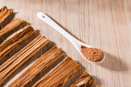 bark and powder of medicinal plant cat's claw, uncaria tomentosaの写真素材